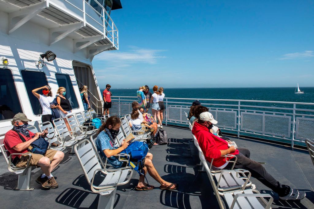 Ferry to Marthas Vineyard Horizontal color photograph of people wearing face masks on the ferry to Marthas Vineyard, Massachusetts.